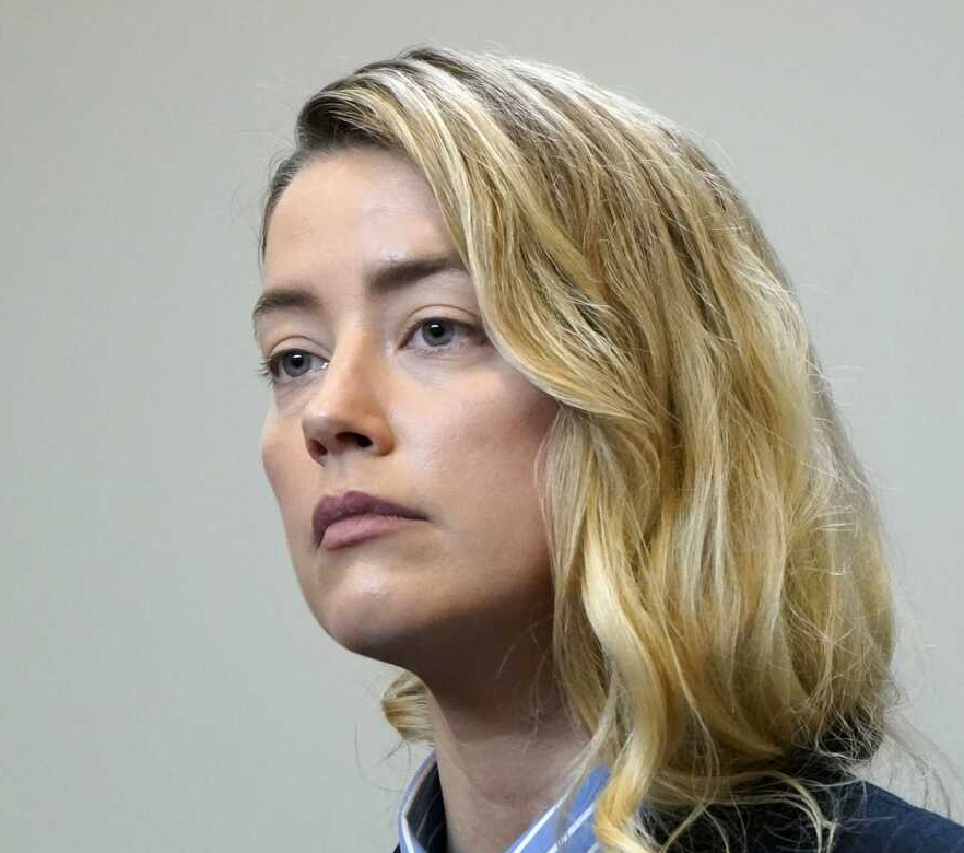 Amber Heard says Johnny Depp struck her when on drugs