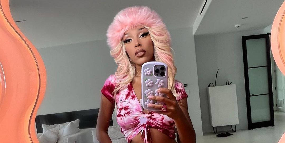 Doja Cat Pairs a Bright Pink Bikini with a Furry Hat and Boots 