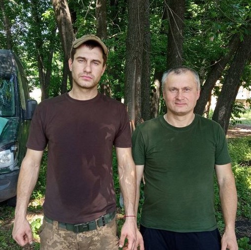 Father Yury Stasovsky carried body of his dead son Dmitry, with whom he fought in
