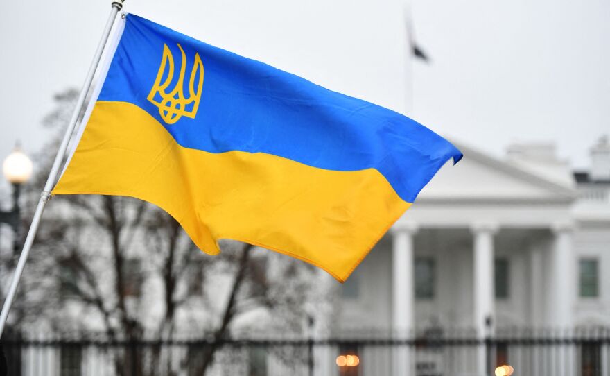 In the US, there are many yellow and blue flags on houses